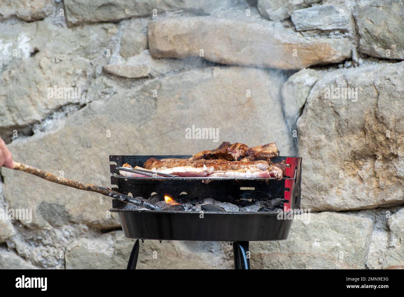Meat cooking on the barbecue grill Stock Photo - Alamy