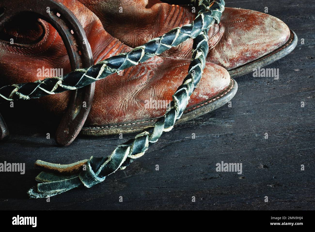 Horseshoe, boots, whip and cowboy hat Stock Photo Alamy