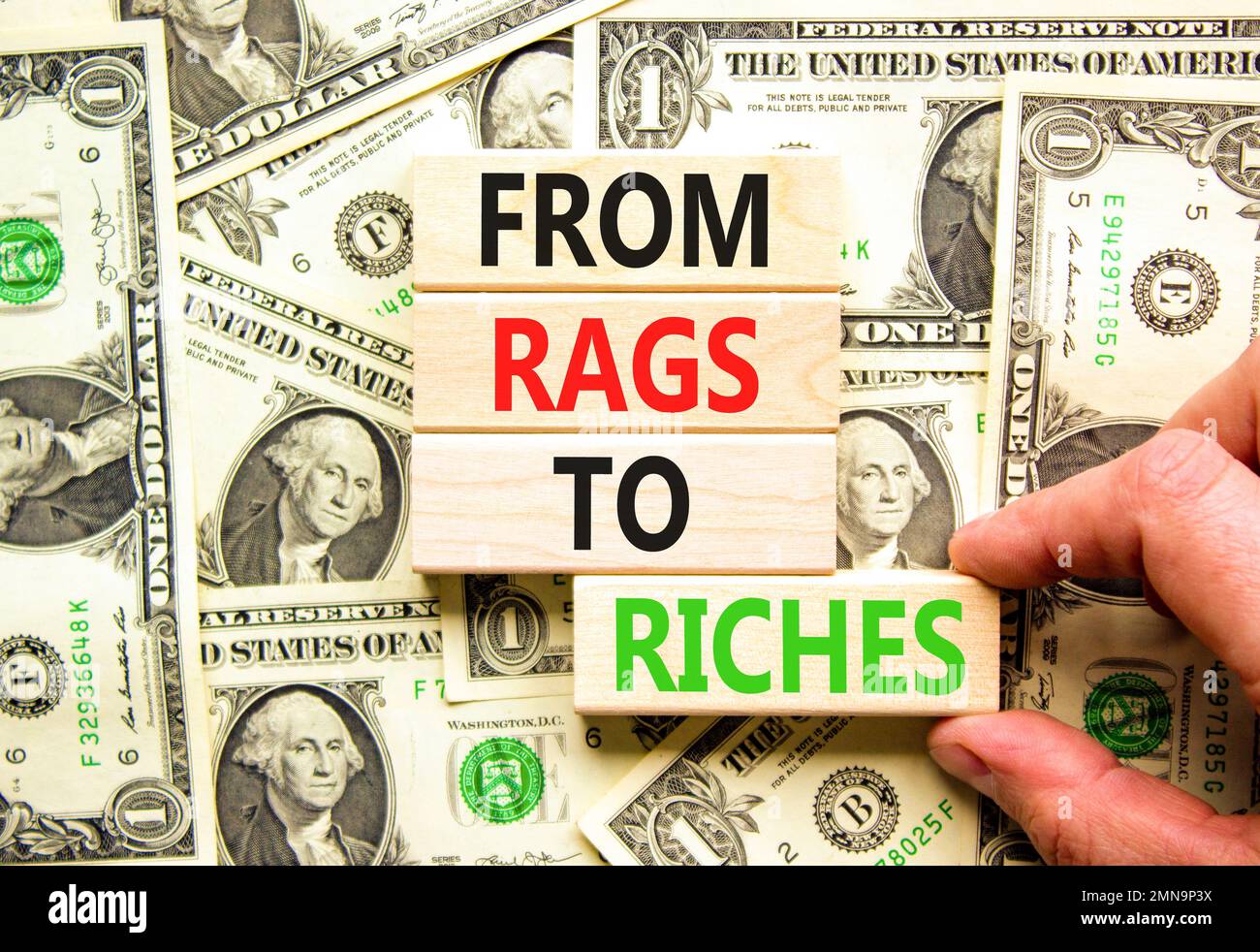 Rags or riches symbol. Concept words From rags to riches on wooden blocks. Beautiful background