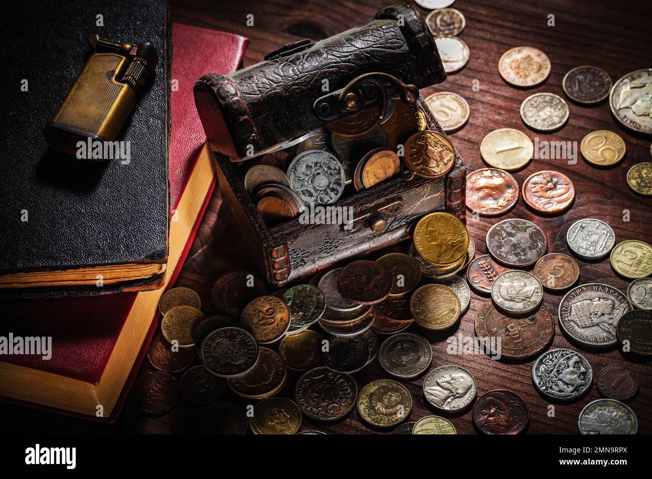 Chest old coins from around the world from 1940 to the new millennium Stock Photo