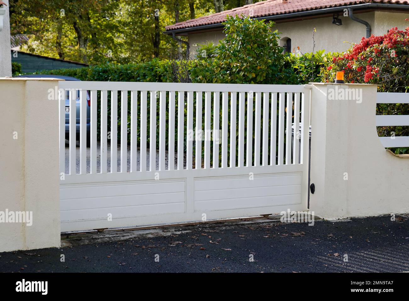 white entry steel modern gate aluminum portal of home door of suburbs house in street view Stock Photo