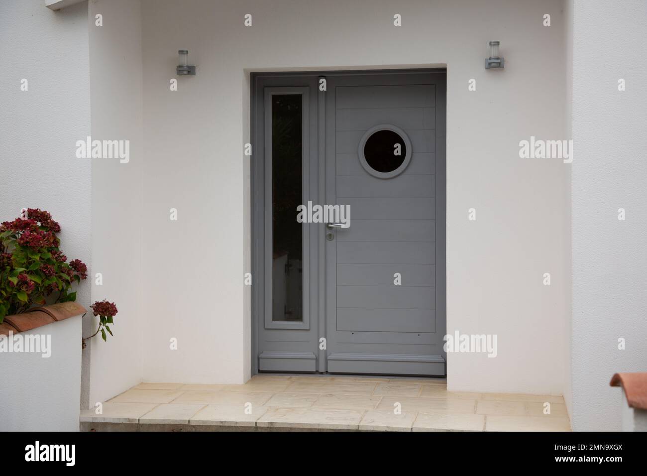 modern house facade with contemporary grey entrance door Stock Photo