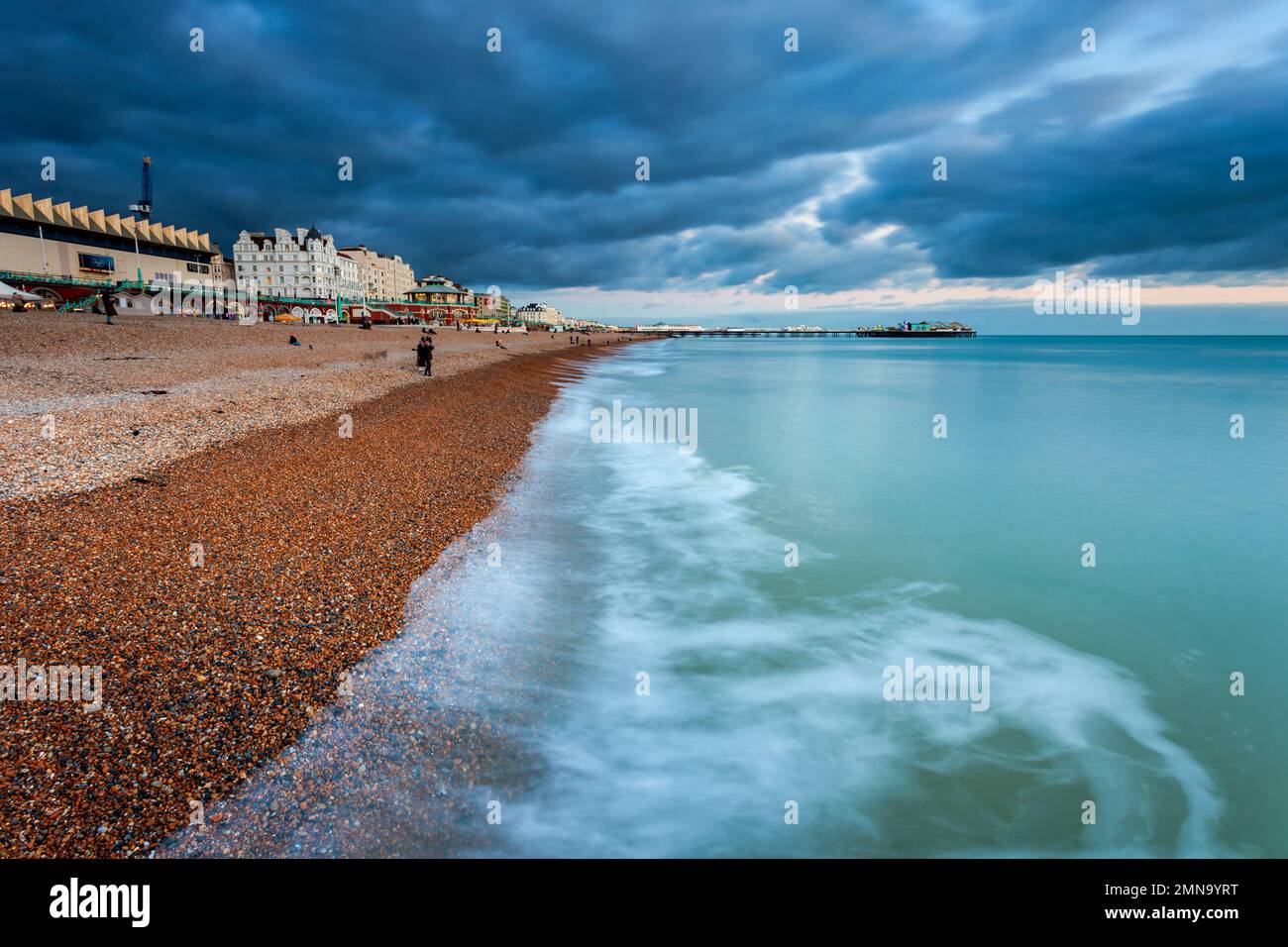 Ominous clouds over Brighton seafront at dusk, East Sussex, England. Stock Photo