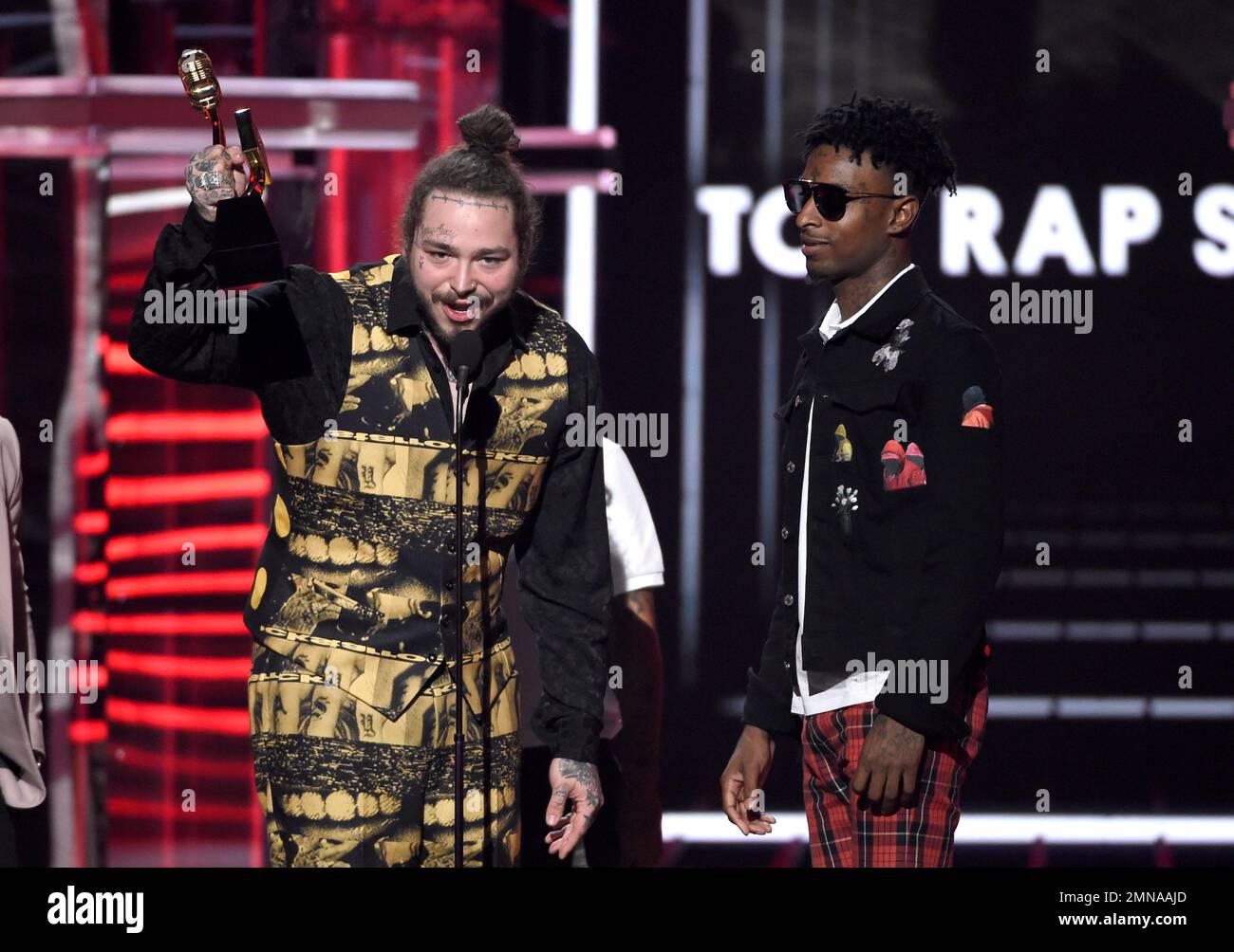 Recording artists 21 Savage (L) and Post Malone appear backstage after  winning the top Rap Song award for 'Rockstar,'' during the 2018 Billboard  Music Awards at MGM Grand Garden Arena on May