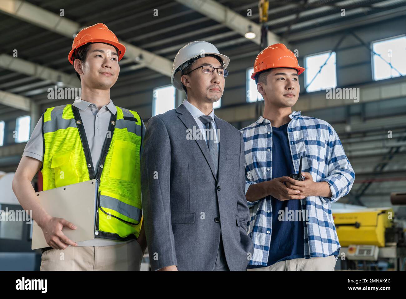 Three architects in the work Stock Photo - Alamy