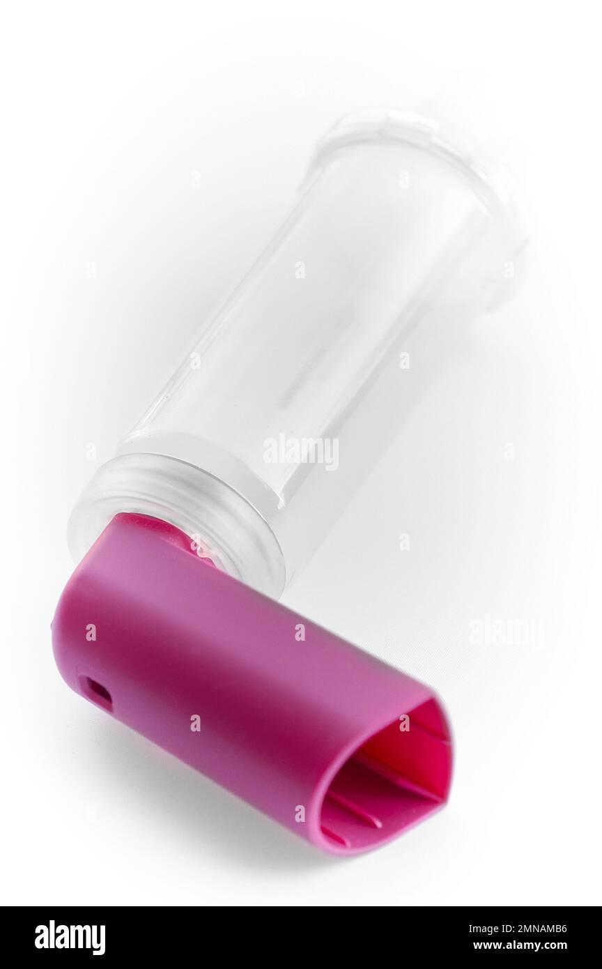 Lung medication with corticosteroids for asthma or COPD. An inhaler with spacer with white background. Stock Photo