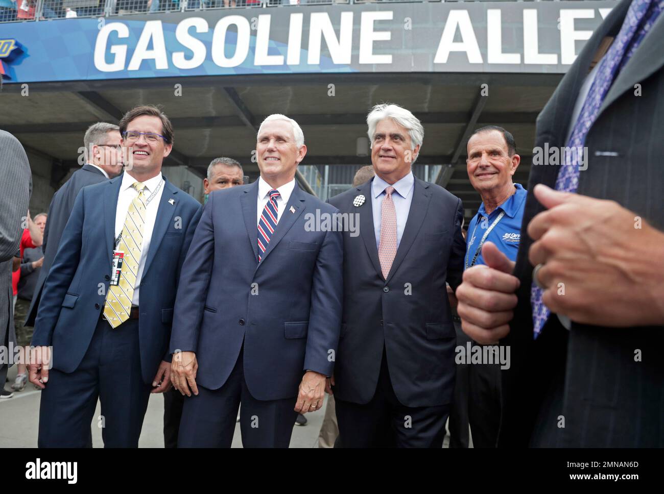 Vice President Mike Pence, second from left, poses for a photo with Doug Boles, Mark Miles and Bob Hillis under the Gasoline Alley sign during a practice session for the IndyCar Indianapolis 500 auto race at Indianapolis Motor Speedway, in Indianapolis Friday, May 18, 2018. (AP Photo/Michael Conroy) Stock Photo