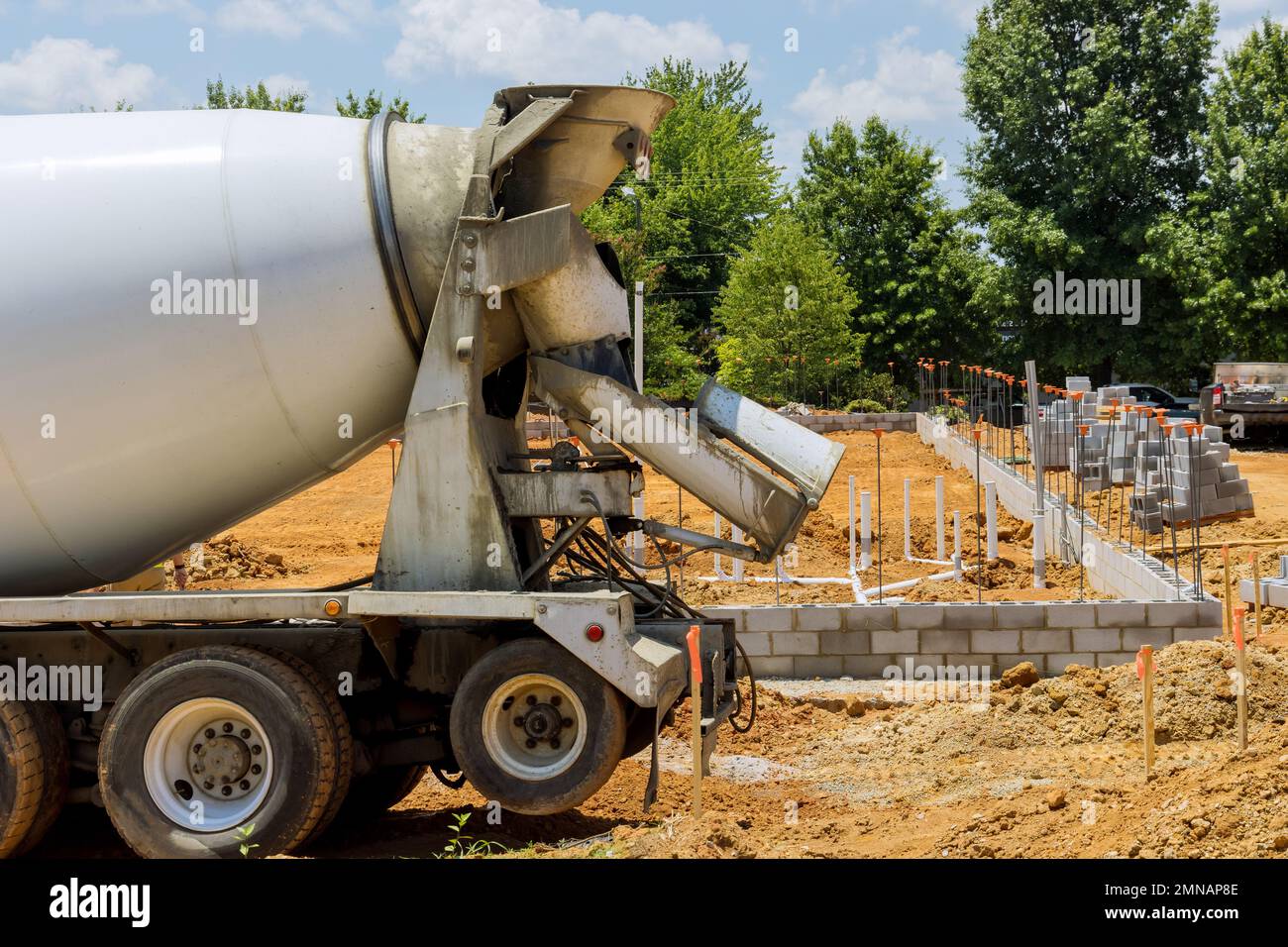 In preparation for pouring concrete columns from concrete mix car at