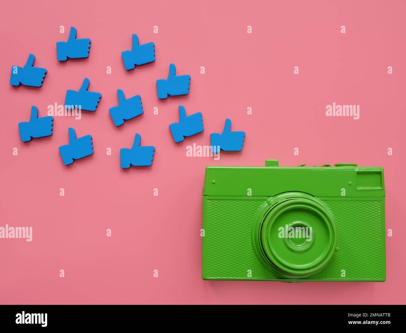 Camera and likes as symbol of modern lifestyle, popularity and social media. Stock Photo