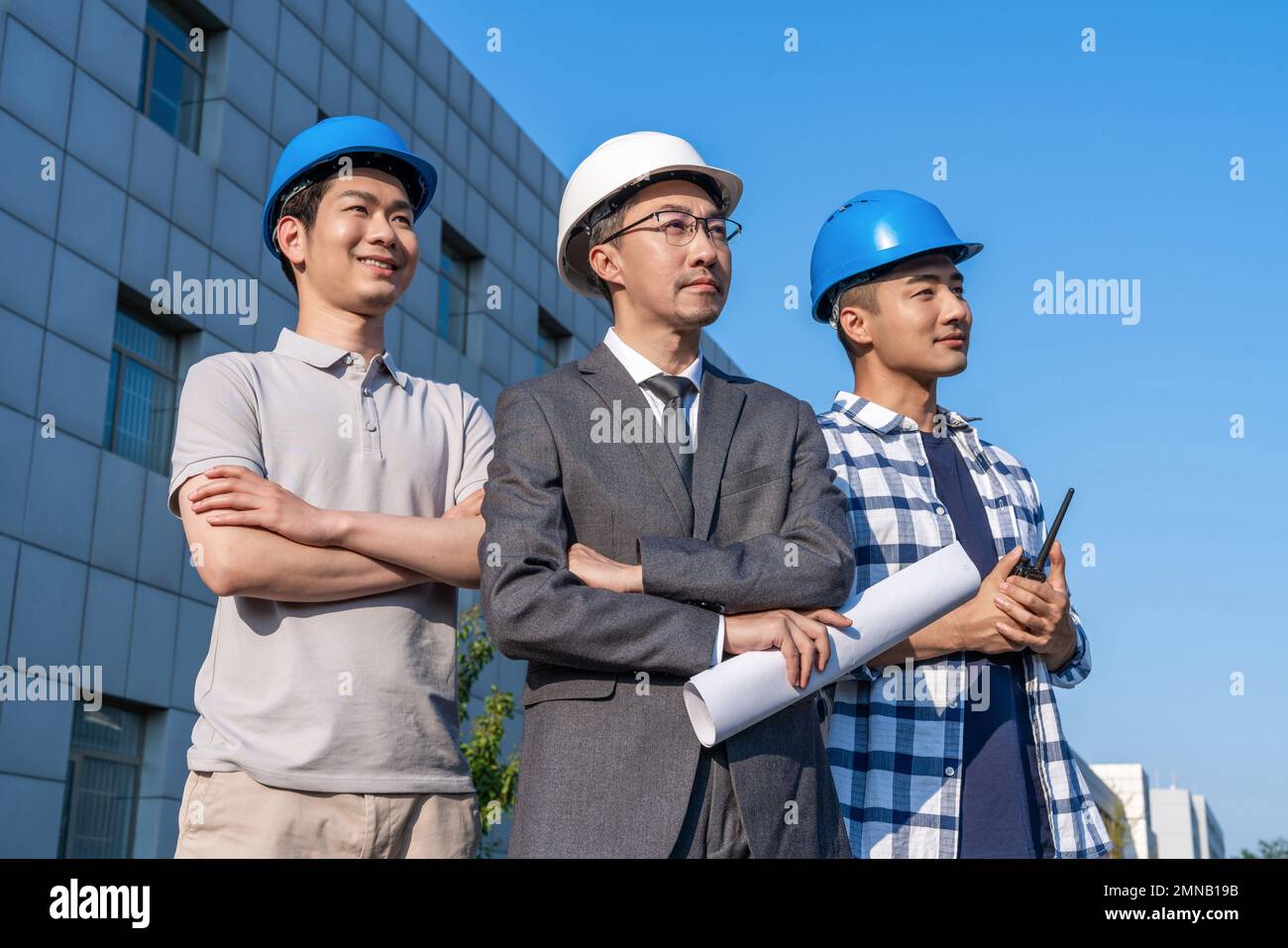 Three engineers working in the outdoor Stock Photo Alamy