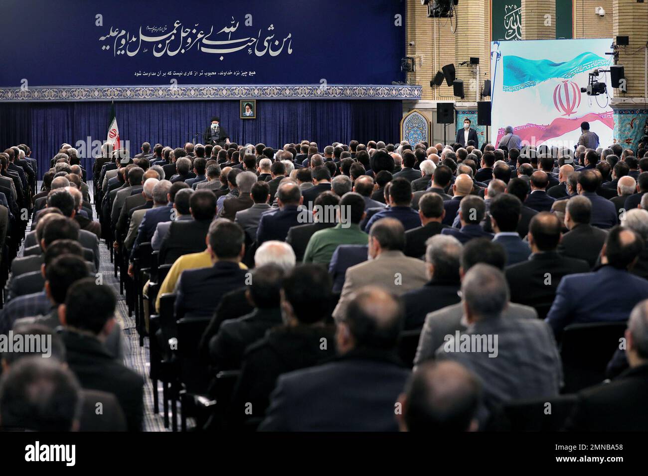 Tehran, Tehran, Iran. 30th Jan, 2023. This handout picture provided by the office of Iran's Supreme Leader Ayatollah ALI KHAMENEI shows him in a meeting with a large group of Iranian entrepreneurs, manufacturers, and knowledge-based companies in the Imam Khomeini Hussainiyah in Tehran on, January 30, 2023. The Leader of the Islamic Revolution stressed on ''rapid, continuous economic growth'' as the current necessity for the country. Khamenei announced that the bright future of the country is in need of rapid and continuous economic growth. The Leader explained the reasons and requirements fo Stock Photo