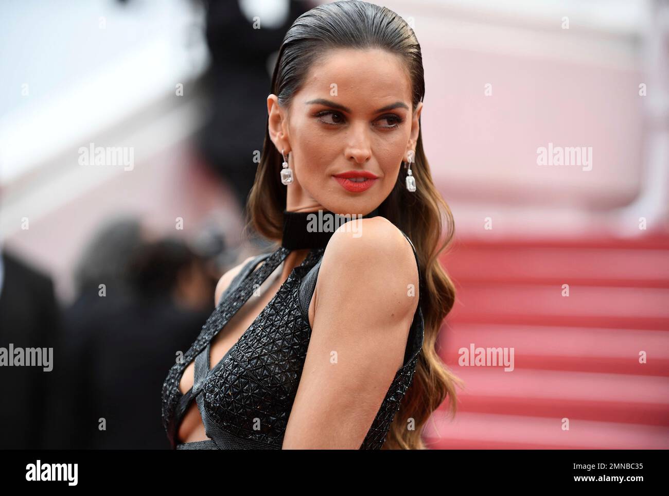 Model Izabel Goulart poses for photographers upon arrival at the