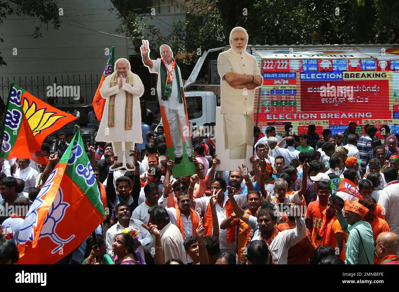 Supporters Of Bharatiya Janata Party (BJP) Carry Cut-out Photographs Of ...