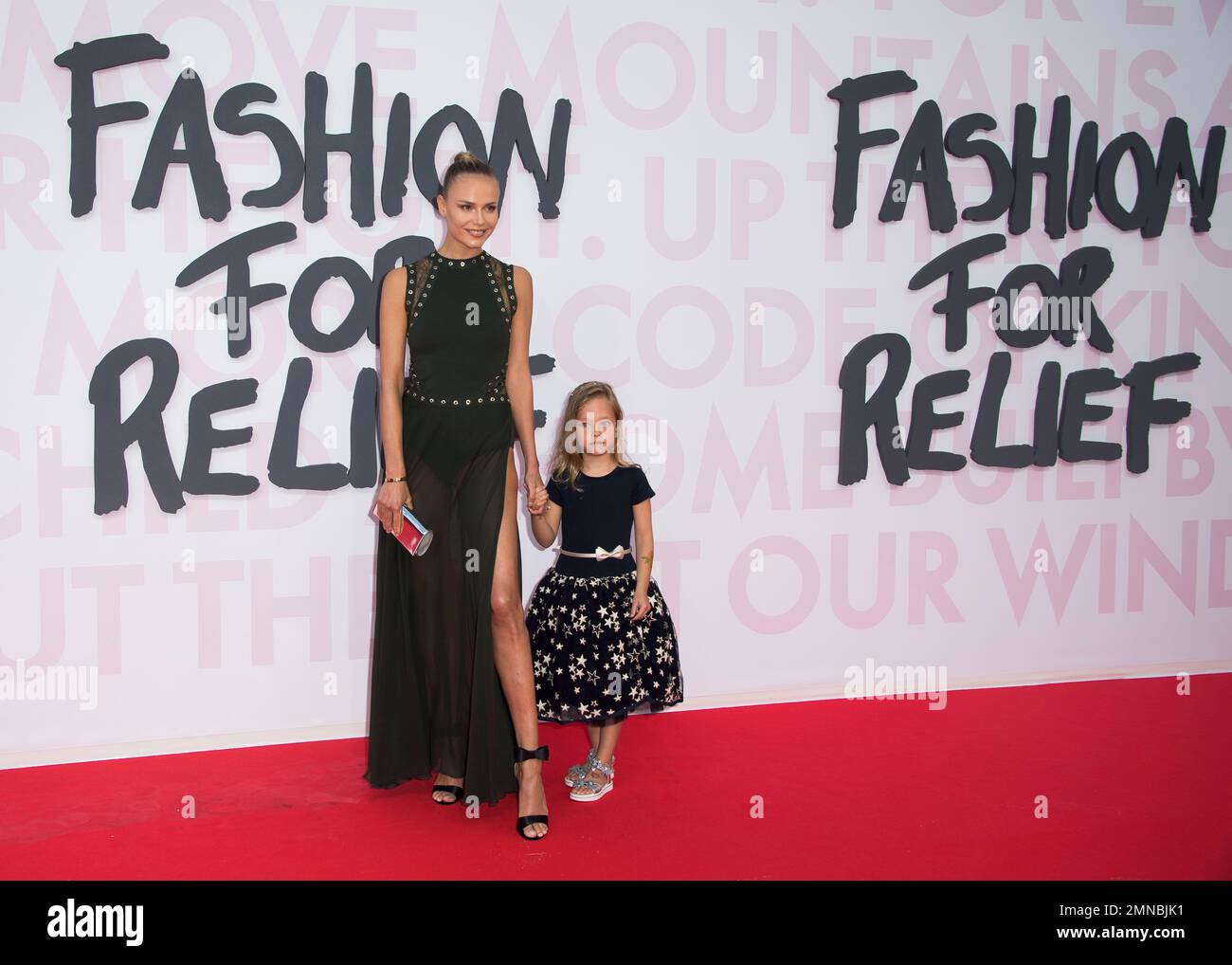 Model Natasha Poly and daughter Aleksandra Christina Bakker pose for