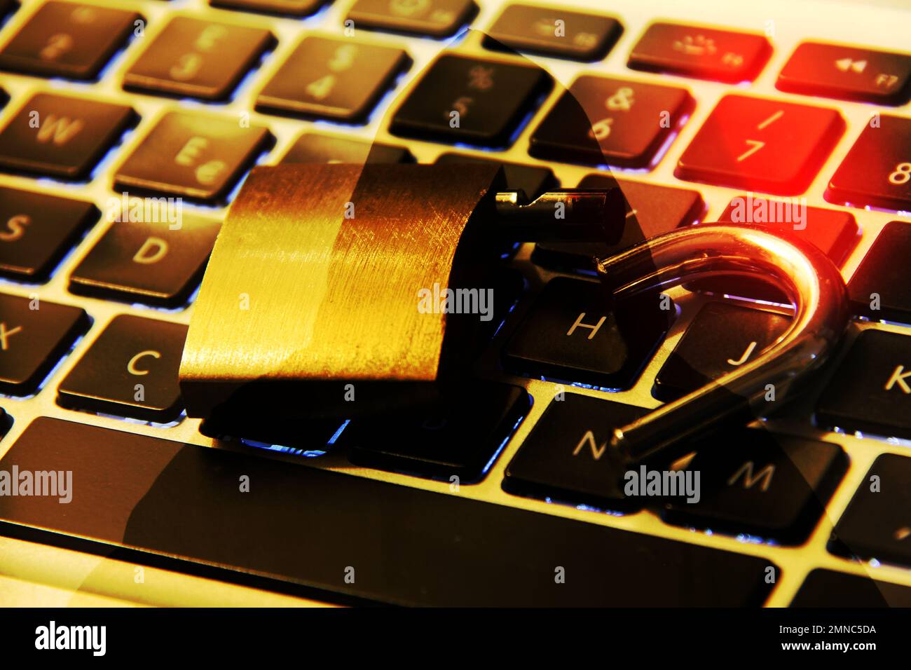 Computer keyboard with open padlock and hacker symbol on silhouette as background. Stock Photo