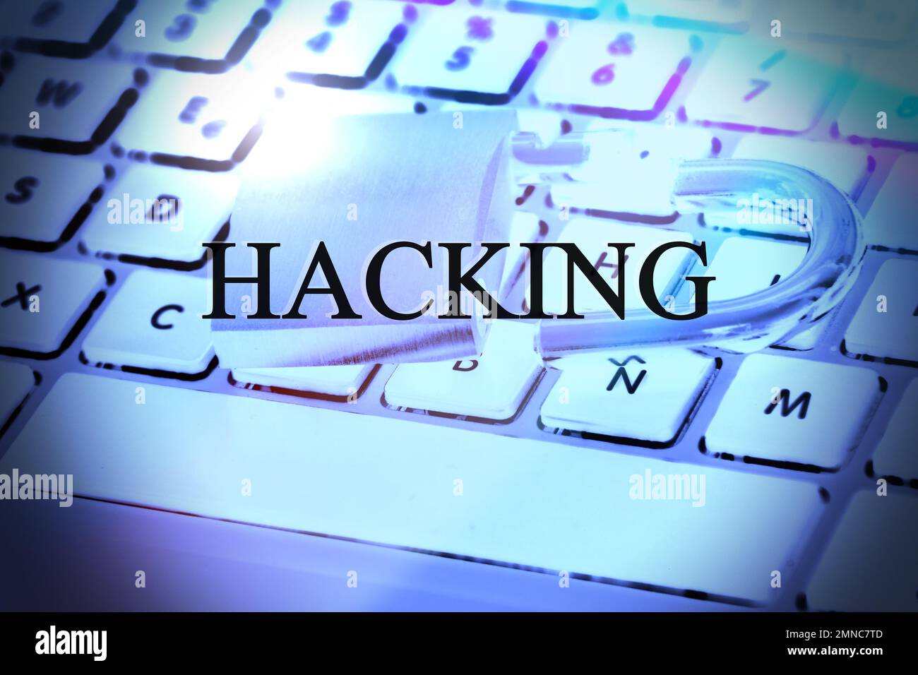 Hacked symbol on computer keyboard with open padlock Stock Photo