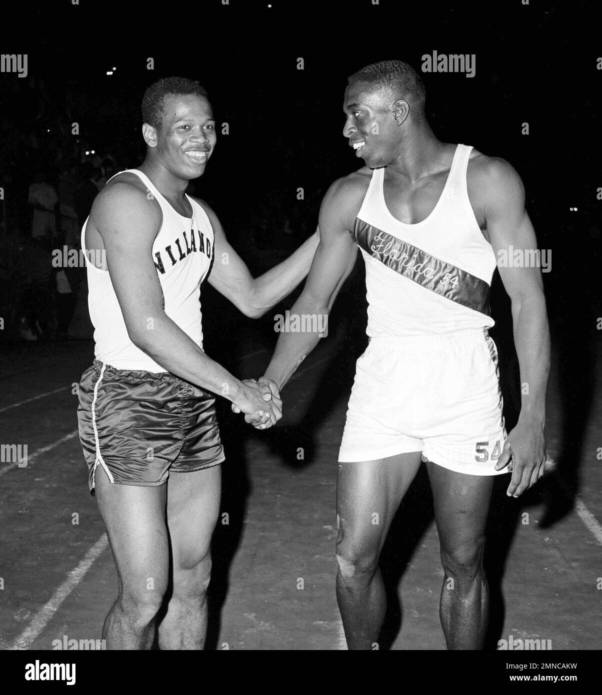 Bob Hayes, right, is congratulated by Frank Budd, world record holder in the 100yard dash