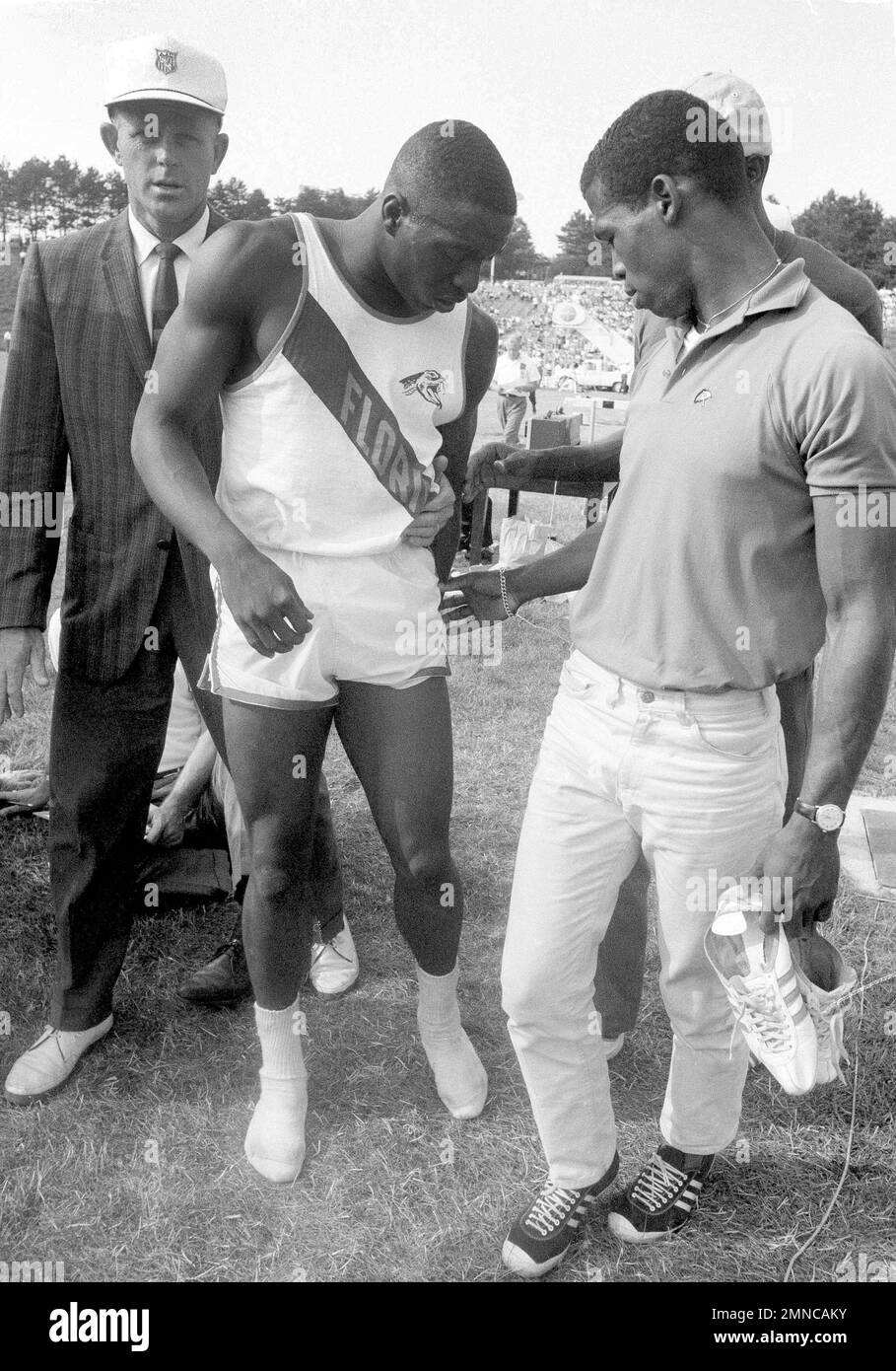 Bob Hayes, Olympics sprint hopeful of Florida A&M, gets assist from field after injuring leg