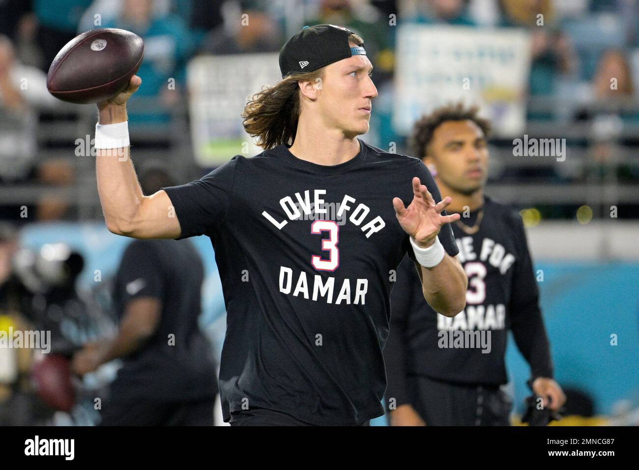 Jacksonville Jaguars quarterback Trevor Lawrence warms up before an NFL football game against the Tennessee Titans, Saturday, Jan. 7, 2023, in Jacksonville, Fla