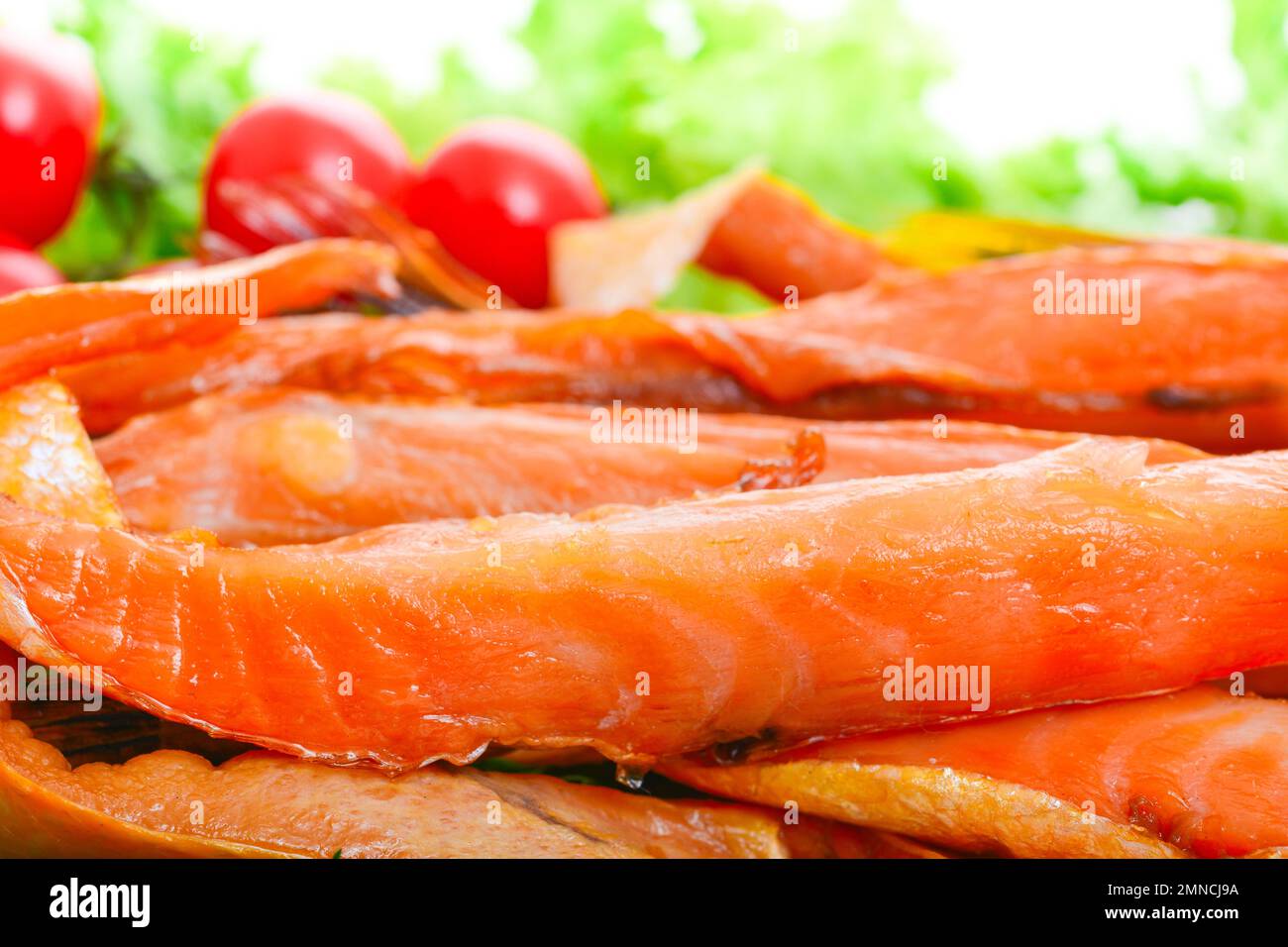 Appetizing smoked fish on a platter Stock Photo