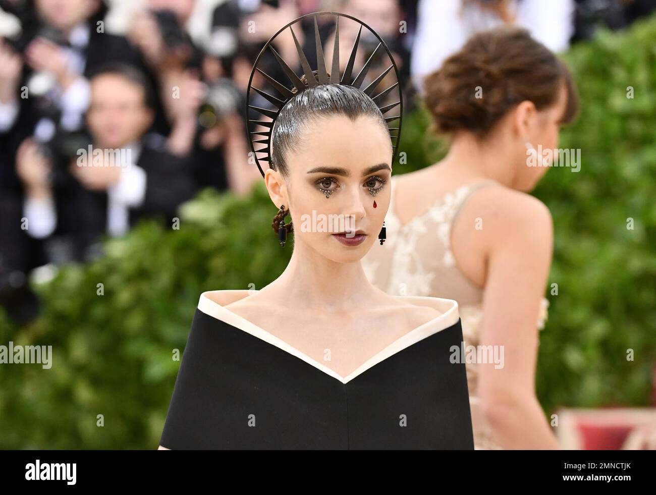 Lily Collins attends The Metropolitan Museum of Art's Costume Institute ...