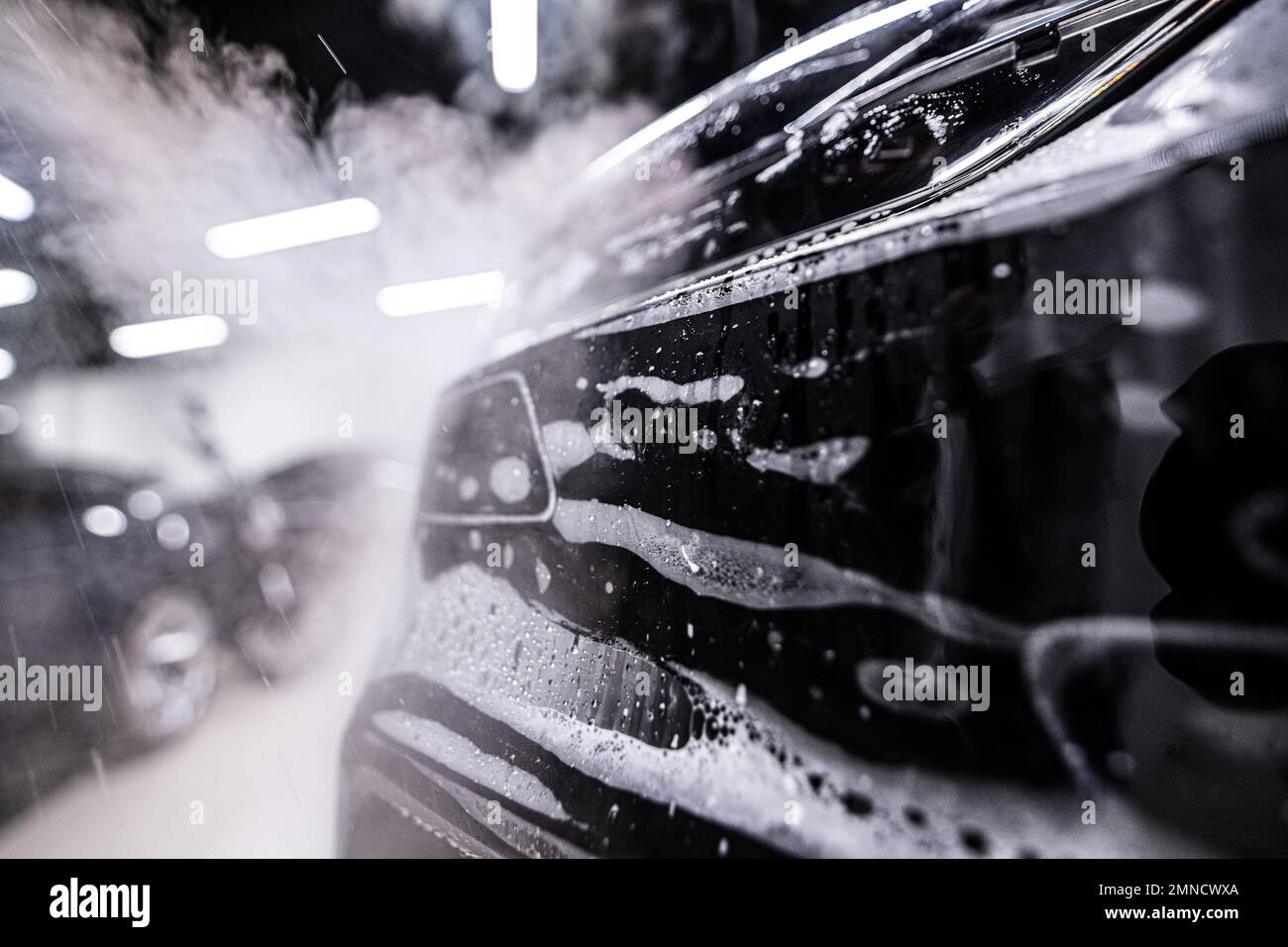 Car during the application of a colorless protective film Stock Photo