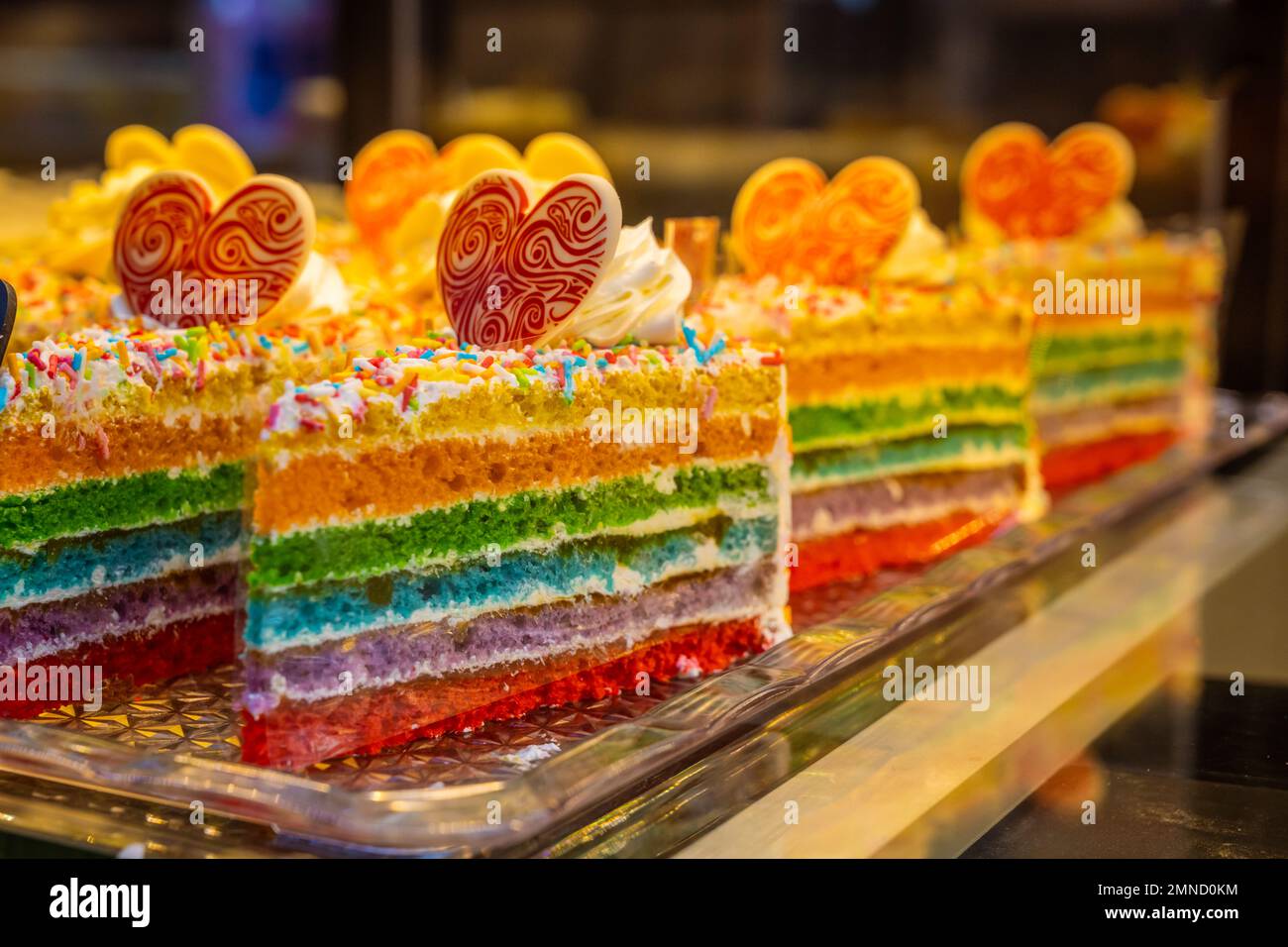 Pieces of rainbow cake in cafe display in Liverpool, United Kingdom
