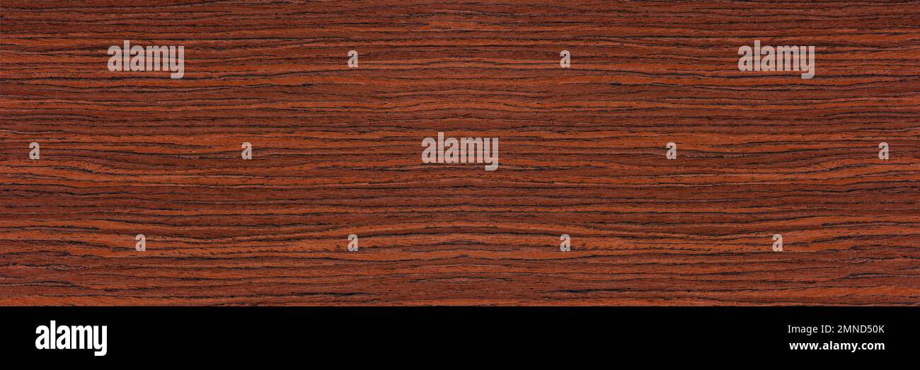 Rosewood texture. Texture of dark mahogany with an intense pattern, natural rosewood veneer for the production of furniture or yacht decoration Stock Photo