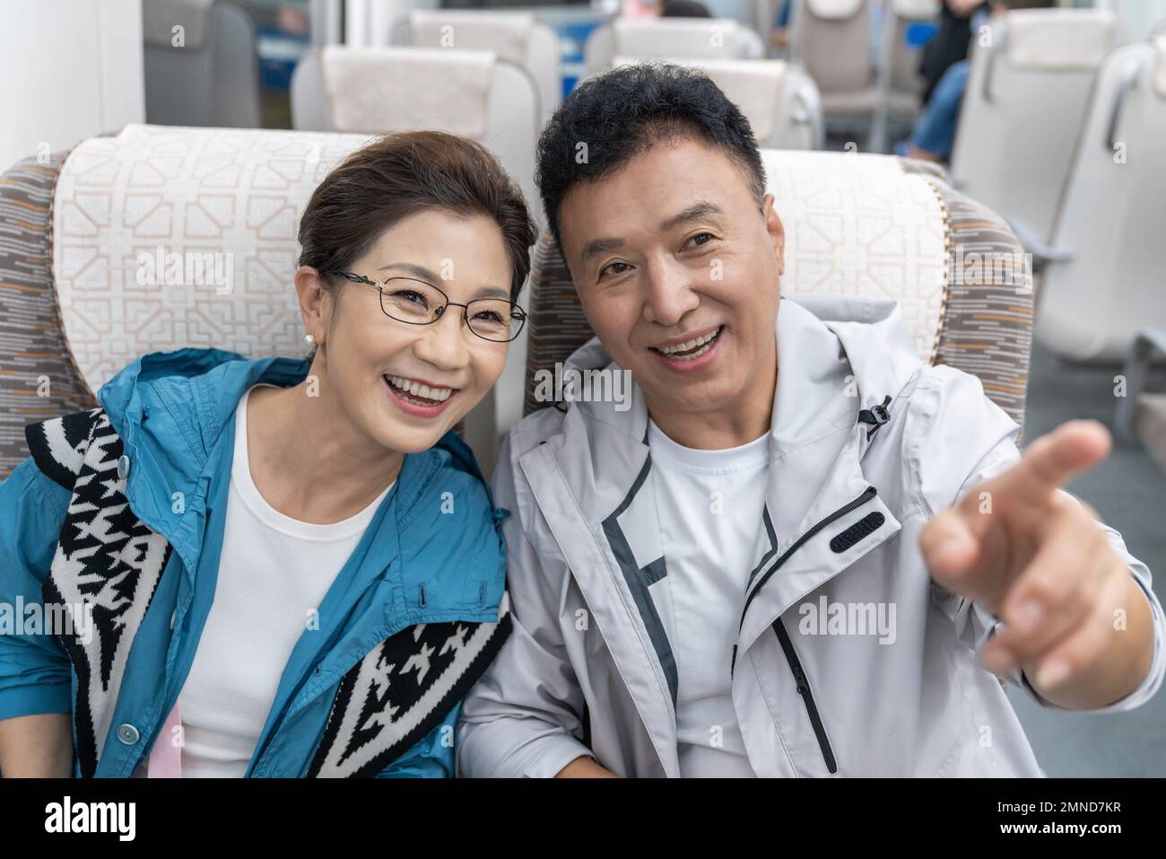 Happy elderly couple take the subway Stock Photo