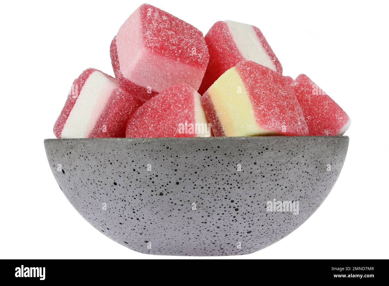 German candy called ‘Hamburger Speck’ in a concrete bowl isolated on white background Stock Photo