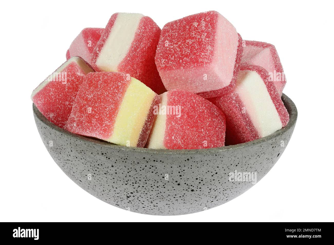 German candy called ‘Hamburger Speck’ in a concrete bowl isolated on white background Stock Photo