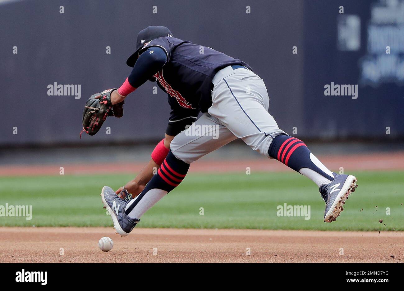 Cleveland Indians shortstop Francisco Lindor commits a fielding error on a  ground ball by New York Yankees' Ronald Torreyes with the bases loaded  during the fifth inning of a baseball game allowing
