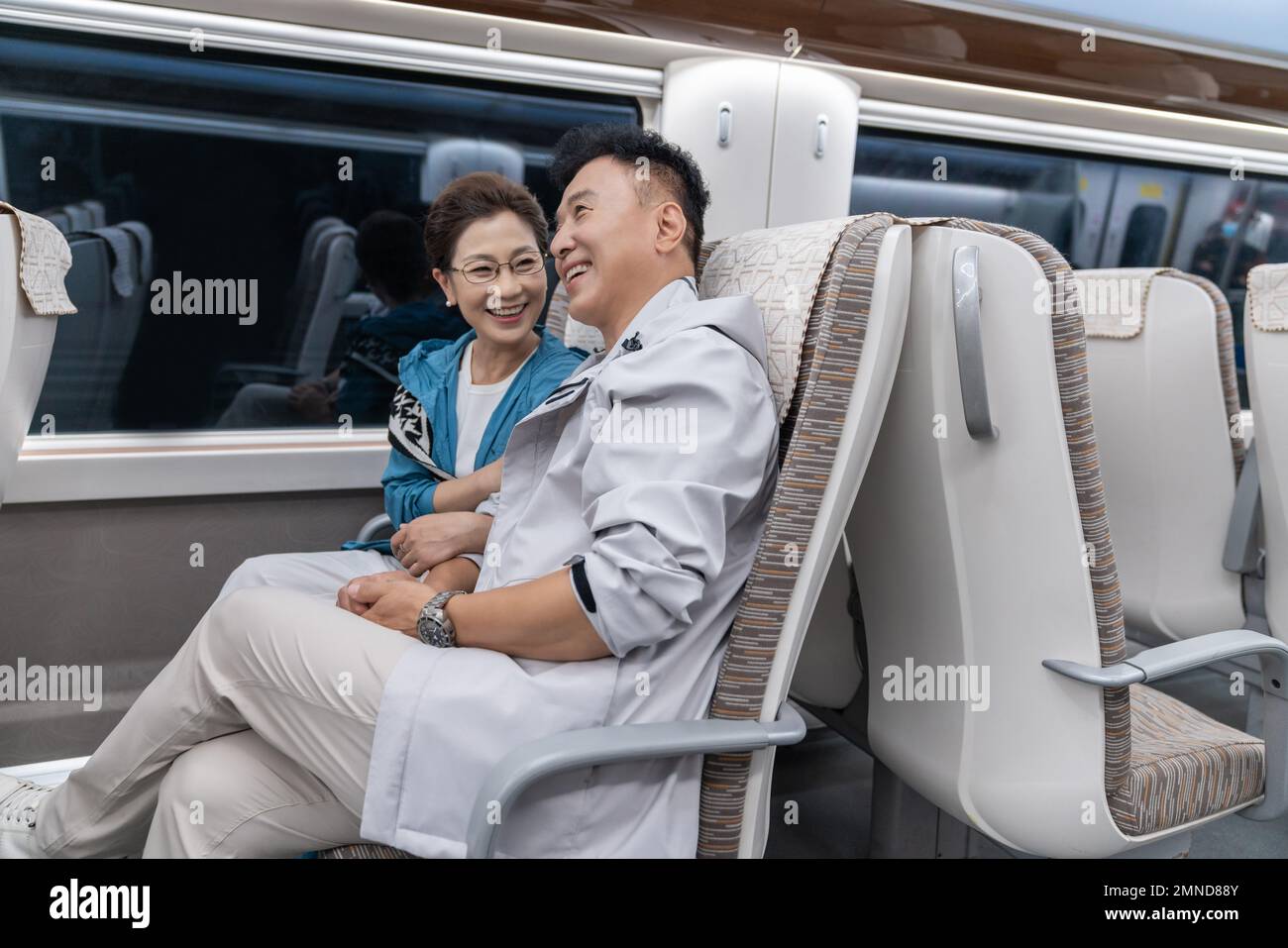 Happy elderly couple take the subway Stock Photo