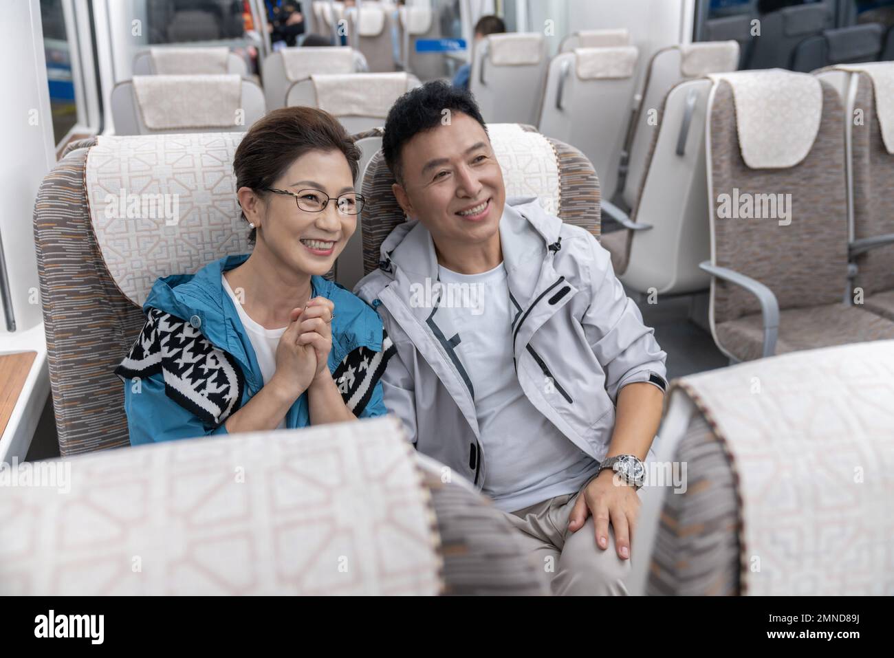 Happy elderly couple take the subway Stock Photo