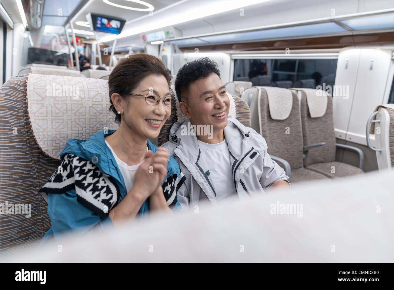 Happy elderly couple take the subway Stock Photo