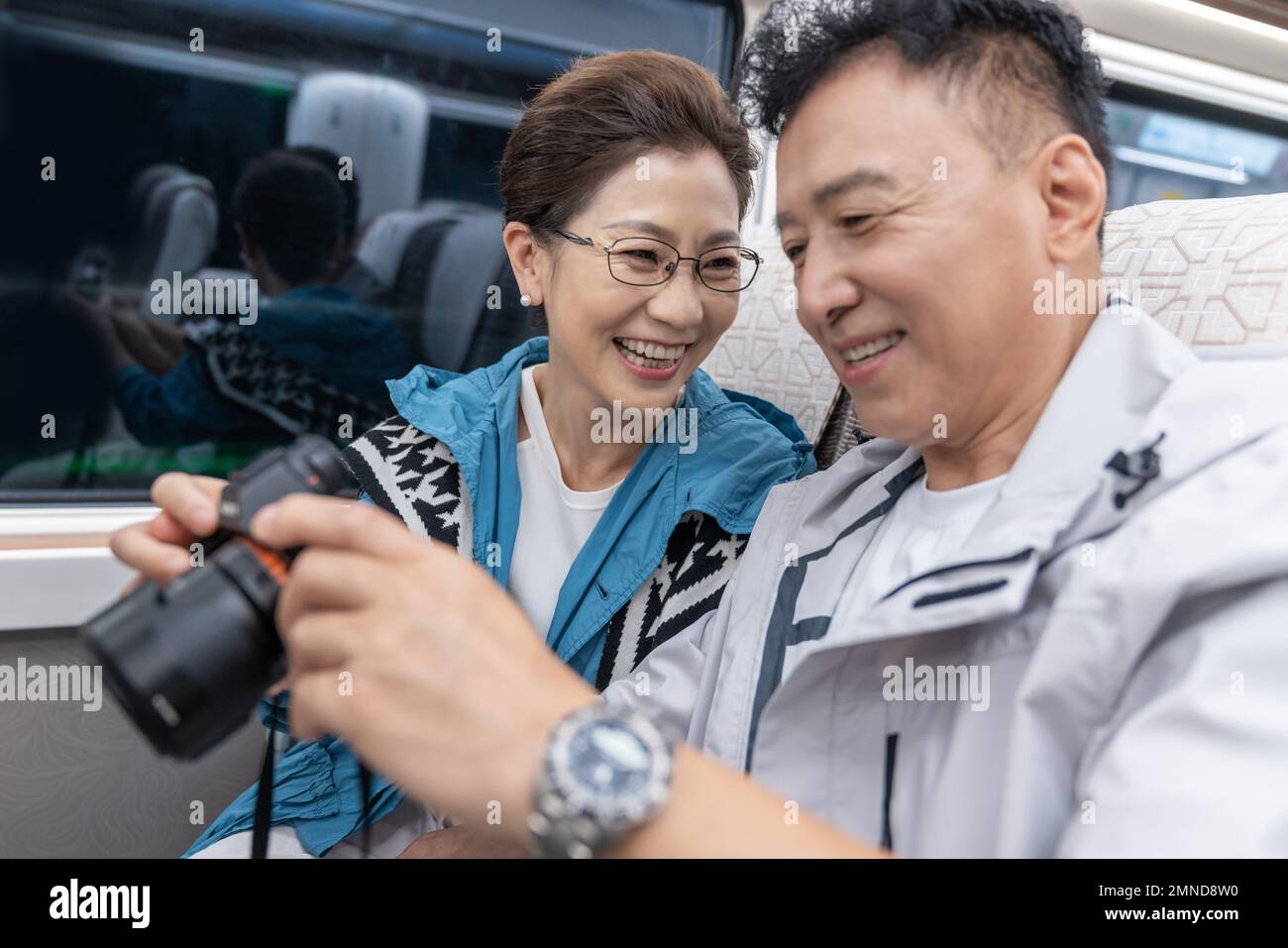 Happy elderly couple take the subway Stock Photo