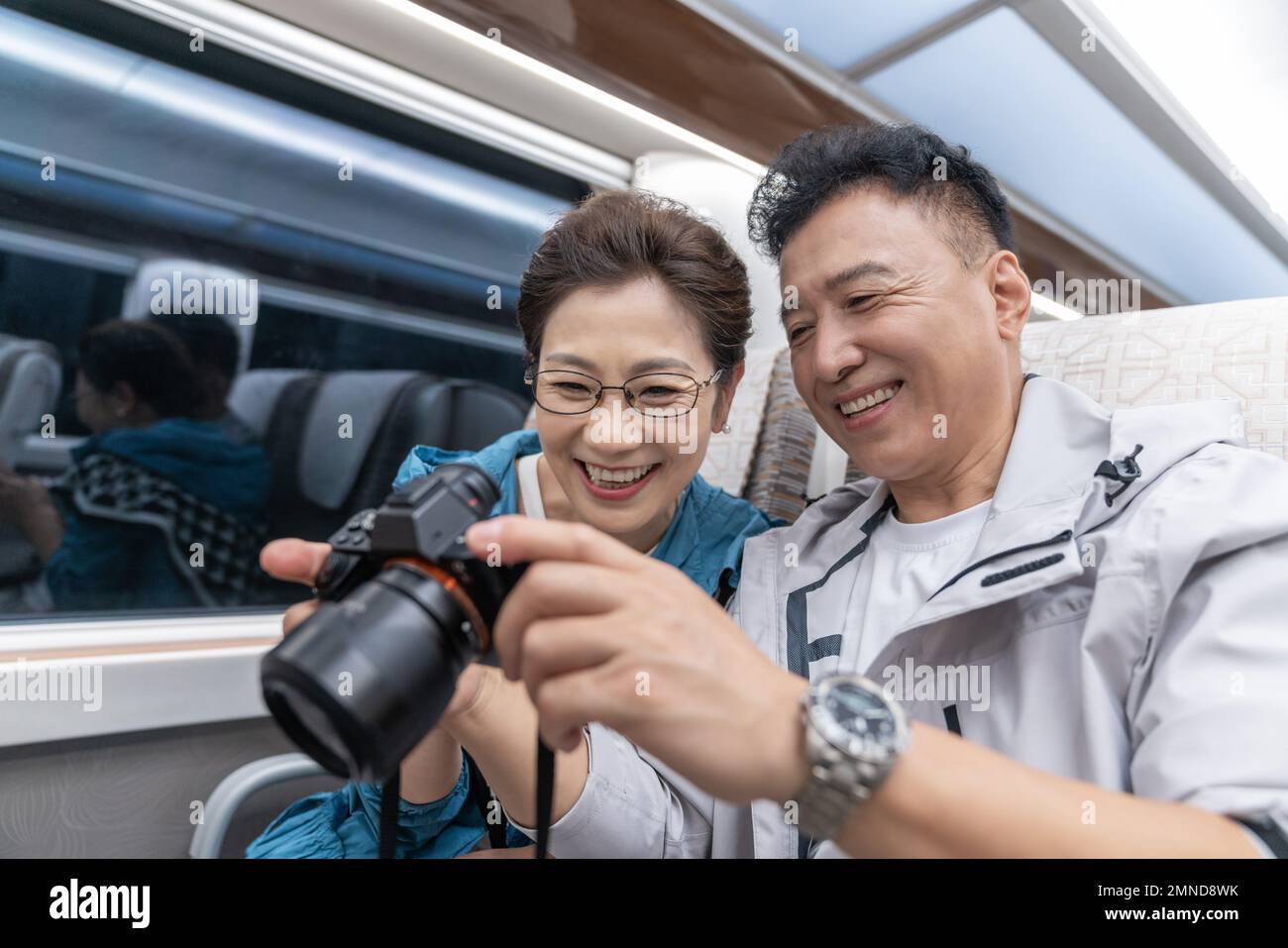 Happy elderly couple take the subway Stock Photo