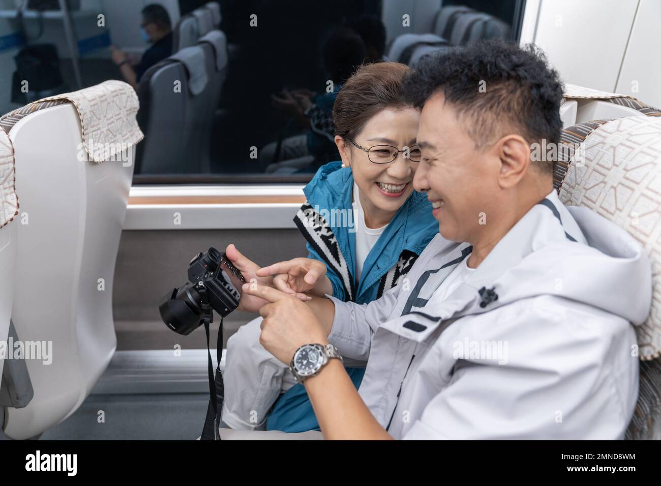 Happy elderly couple take the subway Stock Photo