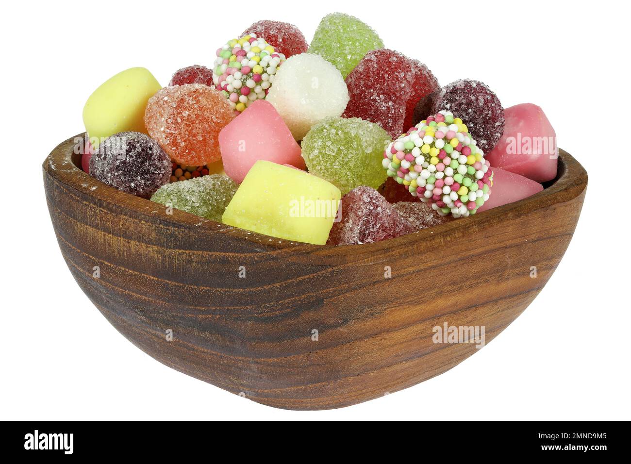 Dutch tum tum candies in a teakwood bowl isolated on white background Stock Photo