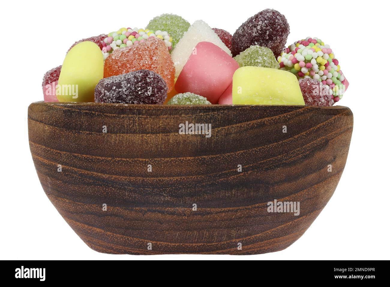 Dutch tum tum candies in a teakwood bowl isolated on white background Stock Photo