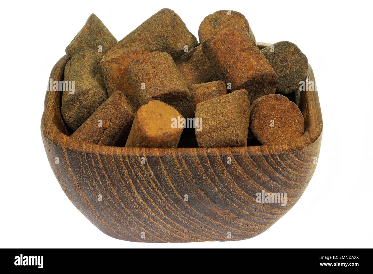 Dutch cinnamon candy sticks in a teakwood bowl isolated on white background Stock Photo
