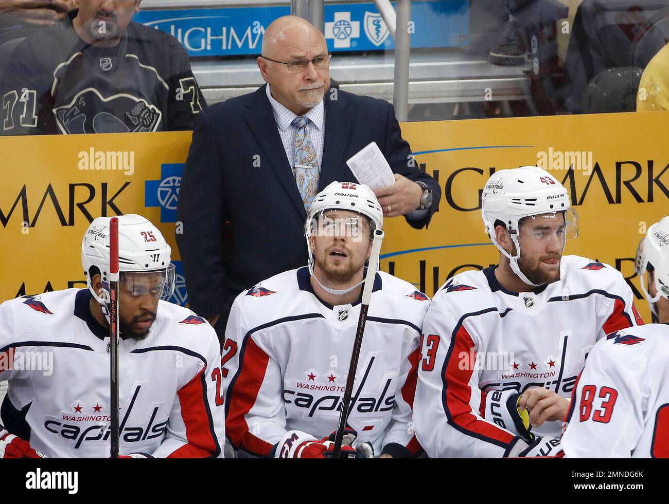 Washington Capitals head coach Barry Trotz stands behind his bench