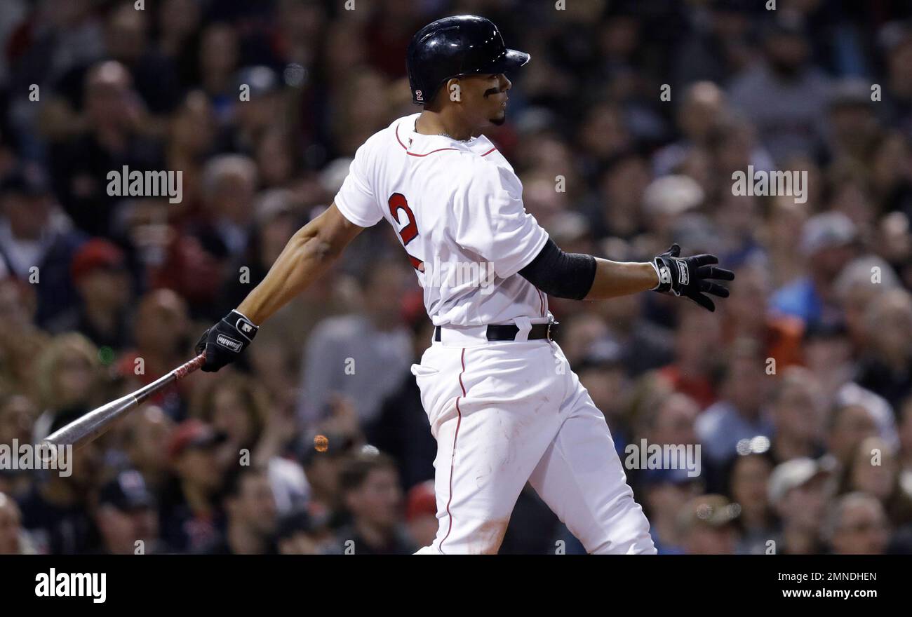 Boston Red Sox shortstop Xander Bogaerts swings during the third inning