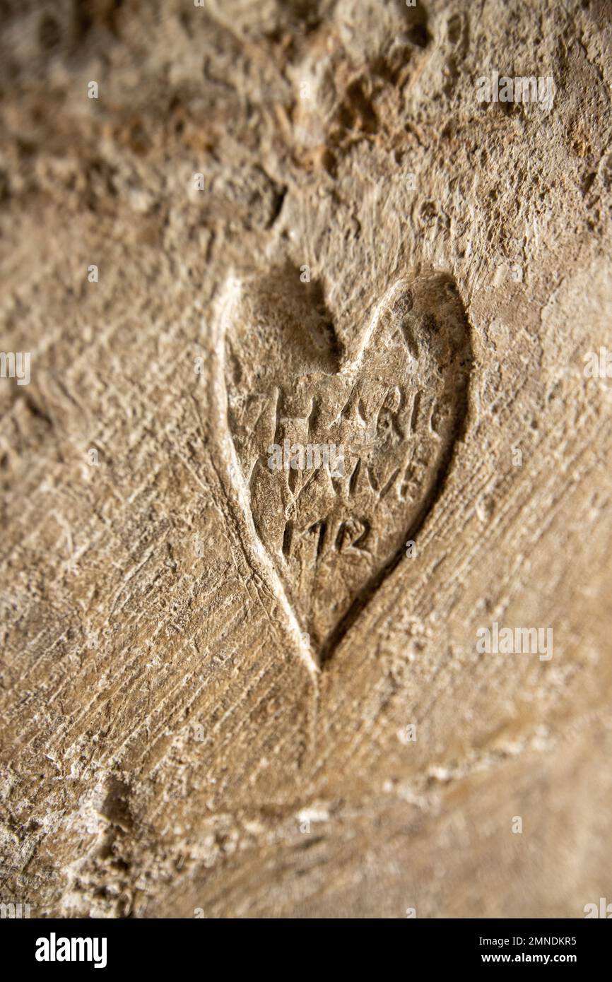 Picture by Tim Cuff. 9 Dec 2022 - 10 Jan 2023. Carving dated 1712 in stone wall at Dover Castle, Kent, England Stock Photo