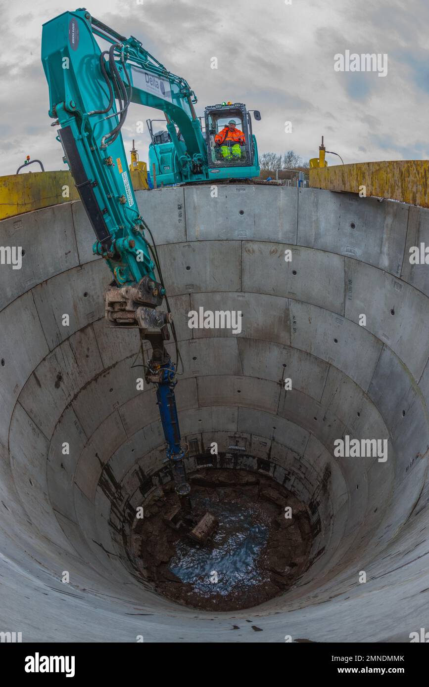 Shaft Excavation 360 Excavator with clam shell bucket Stock Photo Alamy