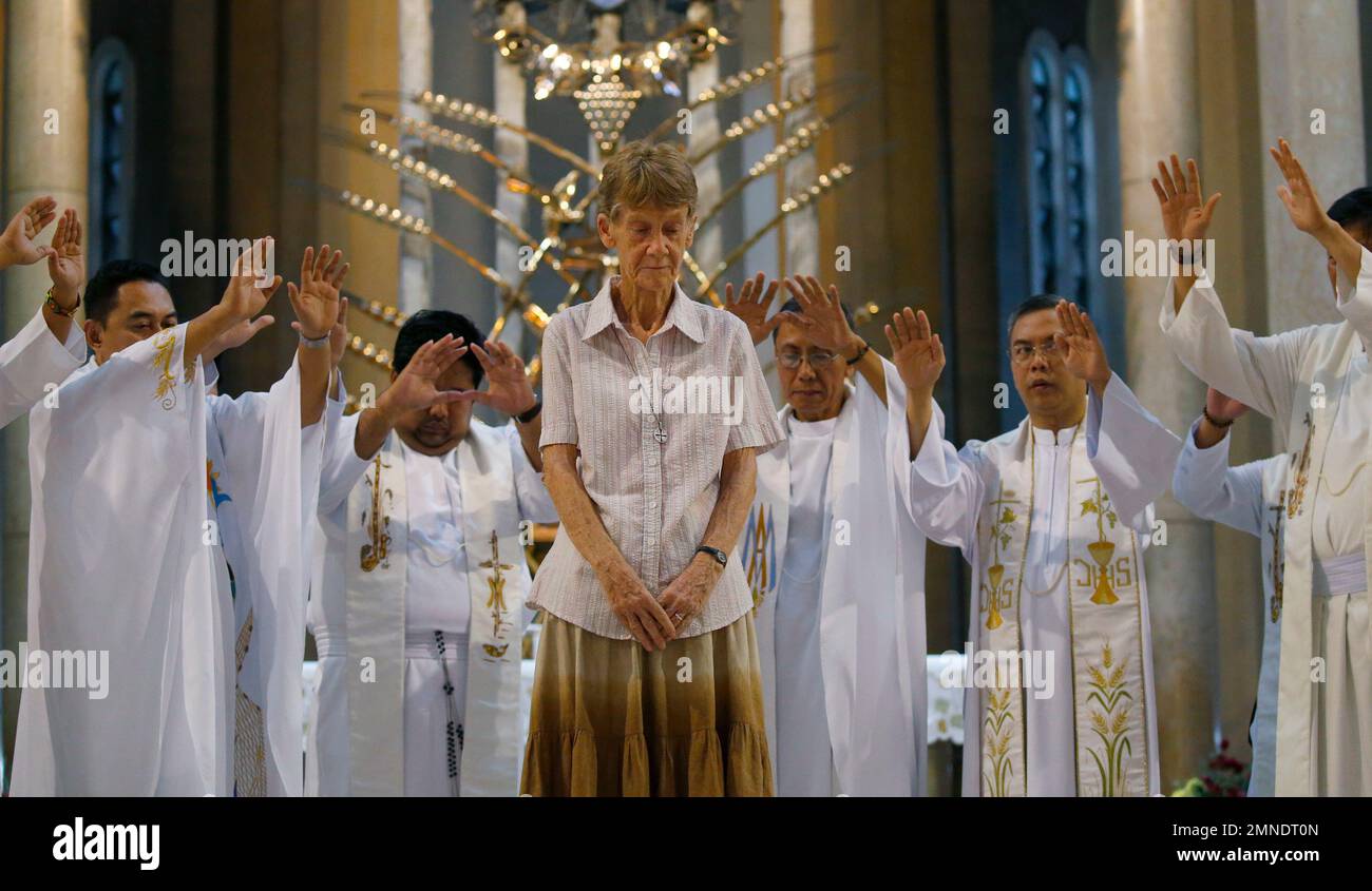 Australian Catholic nun Sister Patricia Fox is prayed over by Roman Catholic  priests during a mass, at the Baclaran Church, Wednesday, May 2, 2018 in  suburban Paranaque city south of Manila, Philippines.