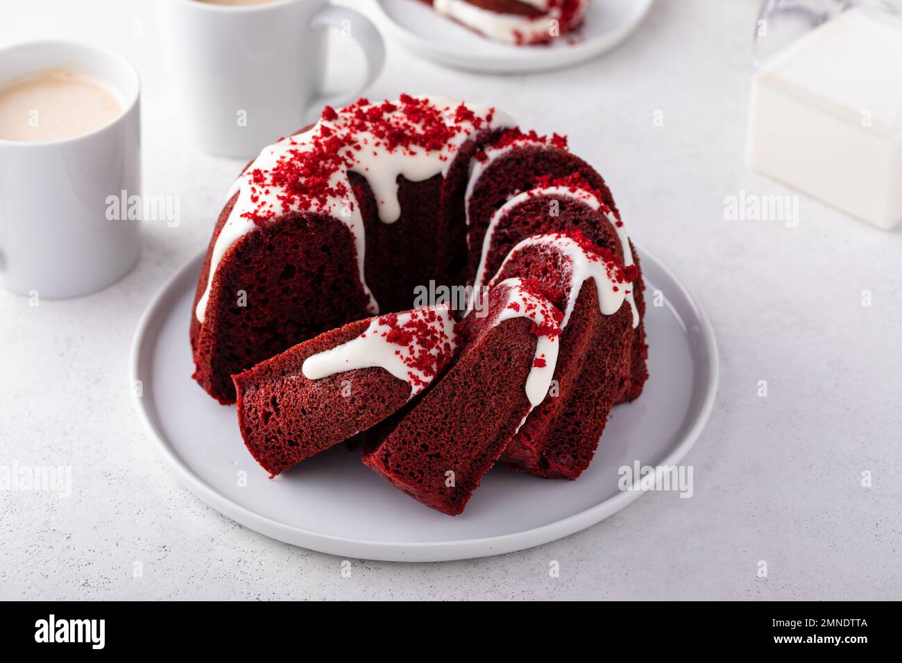 Red velvet bundt cake with cream cheese frosting and cake crumbs Stock Photo Alamy