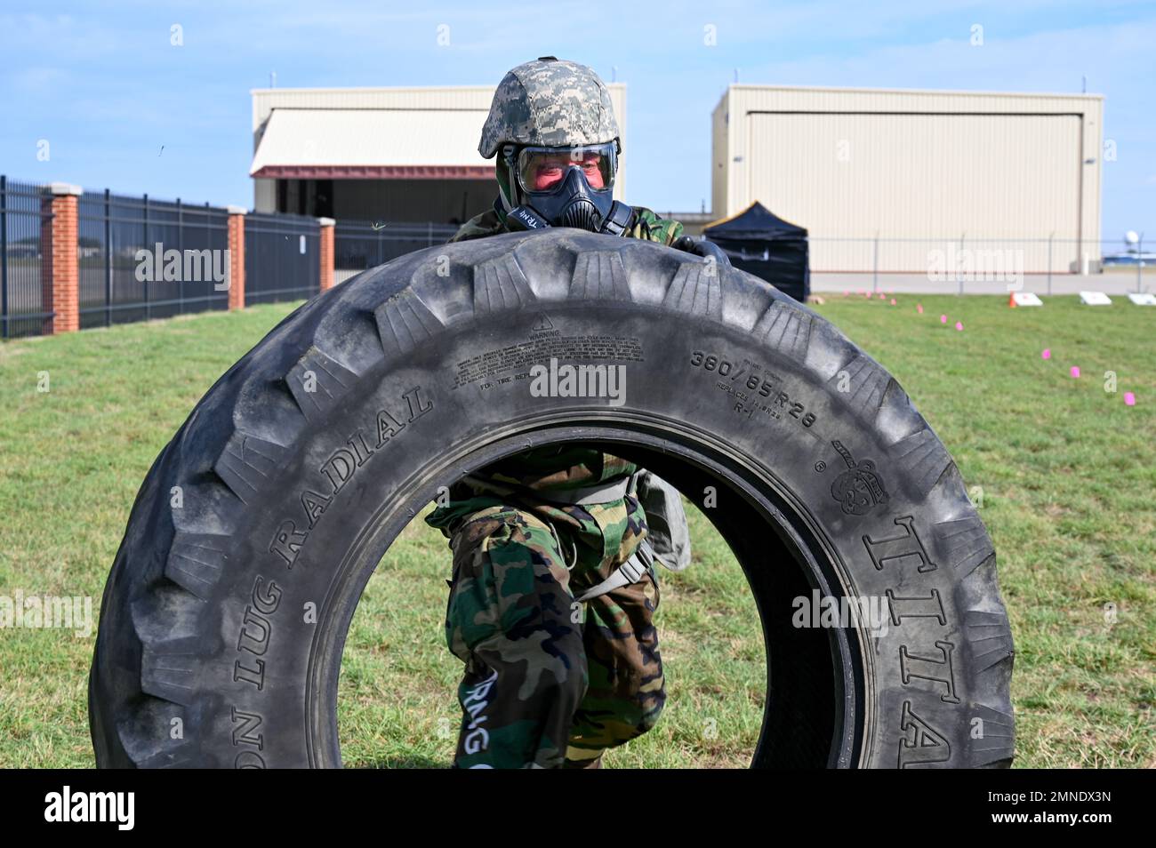 Staff Sgt. Dustin Klatt, 114th Logistics Readiness Squadron vehicle maintenance specialist, flips a Titan Hi Traction Lug Radial tire during an obstacle course event at Joe Foss Field, South Dakota, Oct. 2, 2022. Airmen from the 114th Fighter Wing competed in an obstacle course set up by members from the Counter chemical, biological, radiological, and nuclear (CBRN) All-Hazard Management Response (CAMR) team. Stock Photo