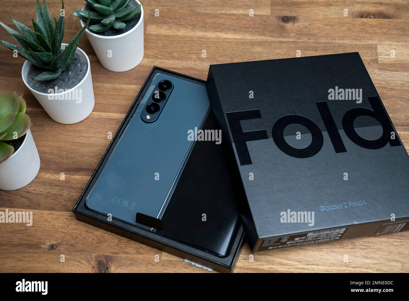 Samsung Galaxy Z Fold 4 in grey-green color. The device is in the open  position. Original box on the s Stock Photo - Alamy