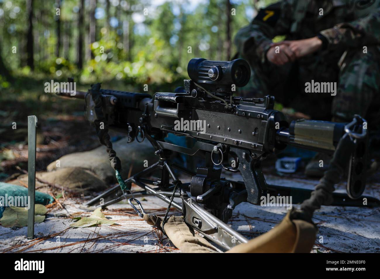 An M240L machine gun sits on a M192 Lightweight Ground Mount tripod as Soldiers of Squad 7, representing the U.S. Army Reserve, train on its use during the Army’s first-ever Best Squad Competition on Fort Bragg, North Carolina, Oct 2, 2022. The Army Best Squad Competition succeeds the Army Best Warrior Competition and extends the competing element from the individual level to the squad level, as Soldiers never fight alone; the unbreakable bonds forged through shared hardship and unending support for one another are the hallmark of our most successful small units. Stock Photo